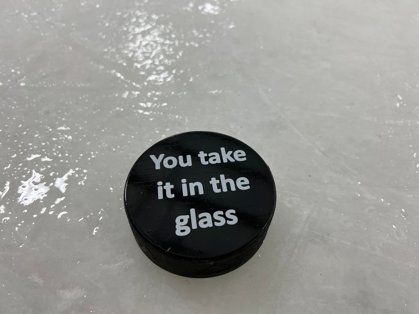 Take Glass Offensive Hockey Puck